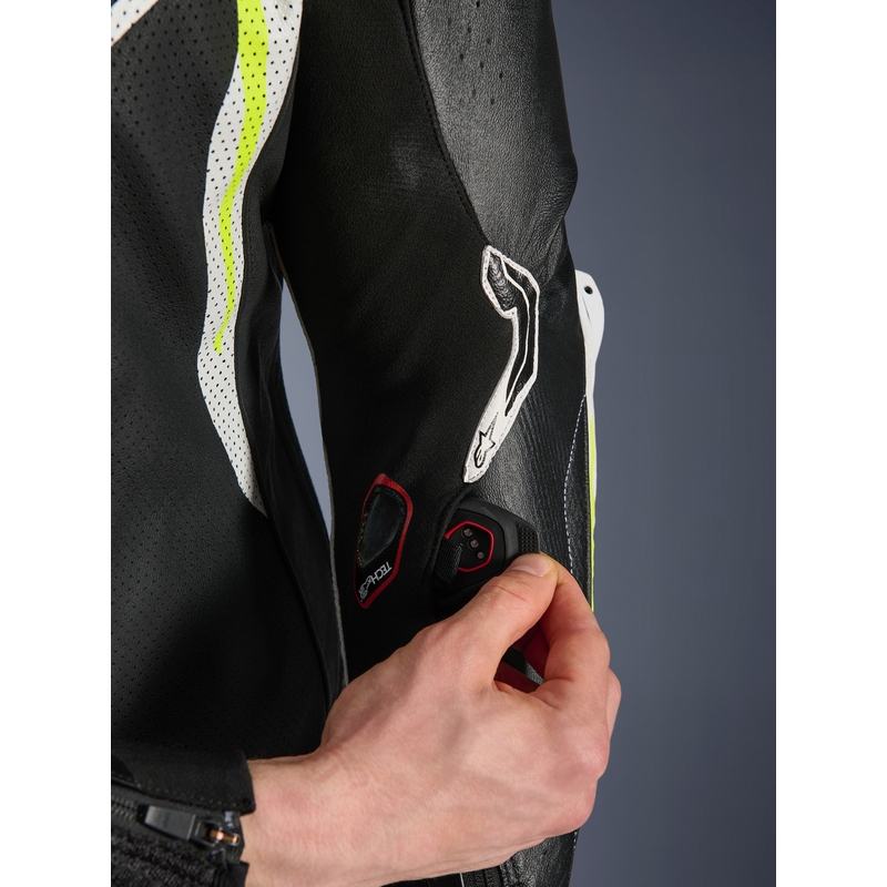 Combinaison de moto Alpinestars GP TECH V5 en cuir monobloc noir-blanc-jaune fluo